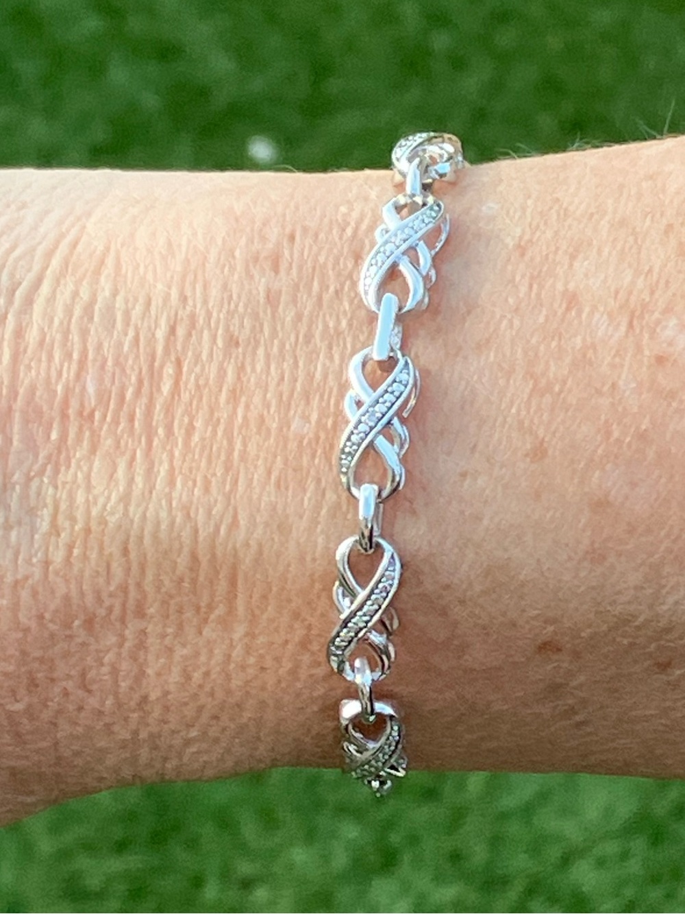 Infinity bracelet, sterling silver, diamonds w/ bolo clasp, adjustable to 9.5"